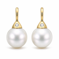 Pearl drop earrings with diamonds in 18K gold on white background