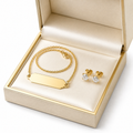 18K gold name necklace and diamond studs gift set on white background