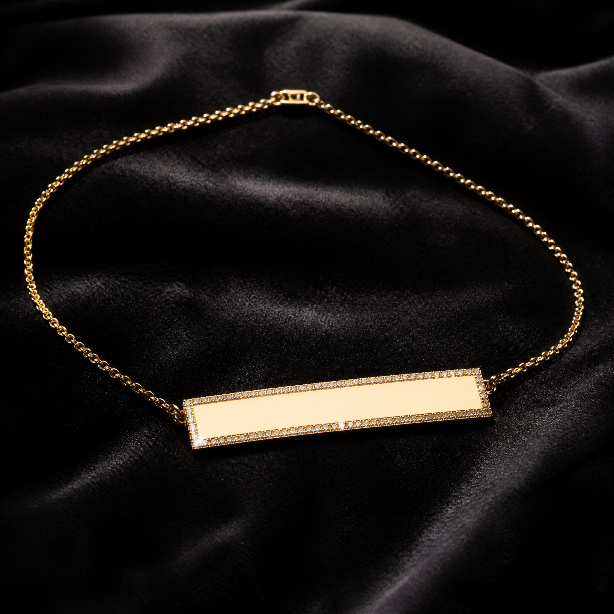 18K gold engravable diamond bar necklace on charcoal velvet