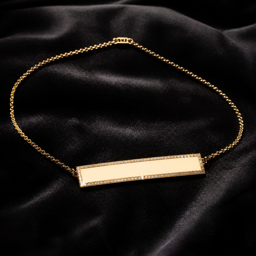 18K gold engravable diamond bar necklace on charcoal velvet